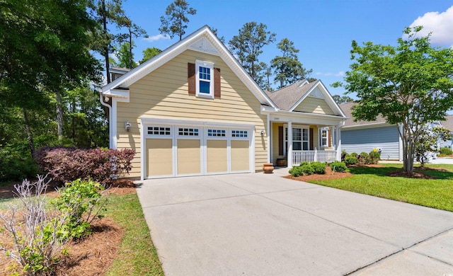 2089 Suncrest Dr, Myrtle Beach, SC 29577 - craftsman-style house featuring a garage, covered porch, driveway, and a front lawn