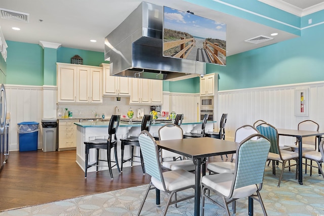 2089 Suncrest Dr, Myrtle Beach, SC 29577 - dining space featuring crown molding, visible vents, and wainscoting