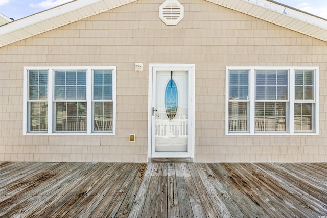 doorway to property featuring a wooden deck