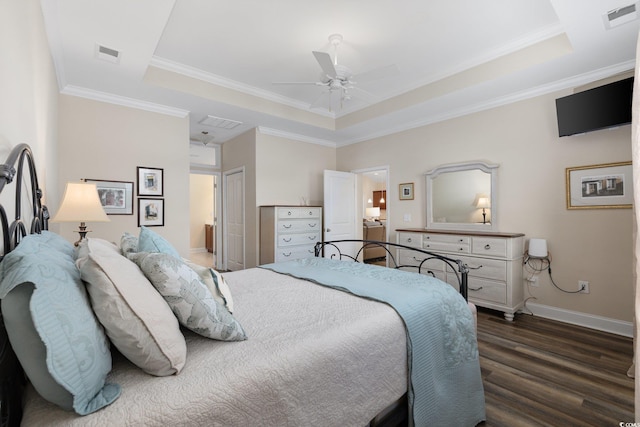 179 Hyacinth Loop, Murrells Inlet, SC 29576 - bedroom featuring a tray ceiling, dark wood-style flooring, baseboards, and visible vents