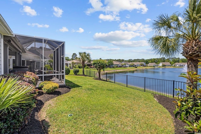 179 Hyacinth Loop, Murrells Inlet, SC 29576 - view of yard with a water view, glass enclosure, and a fenced backyard