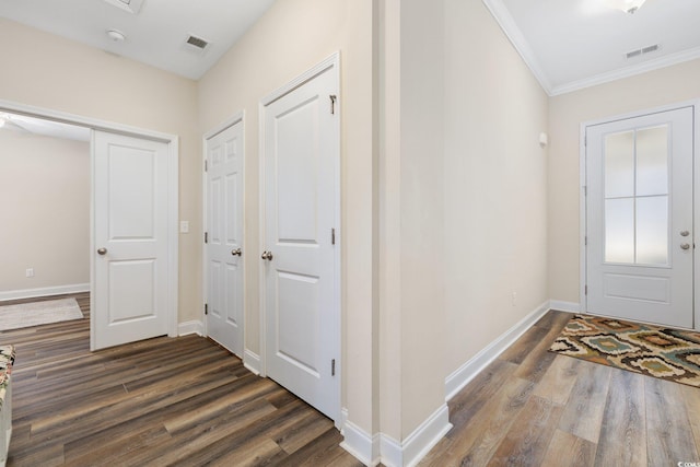 179 Hyacinth Loop, Murrells Inlet, SC 29576 - foyer entrance featuring crown molding, dark wood finished floors, visible vents, and baseboards
