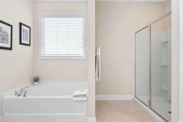 179 Hyacinth Loop, Murrells Inlet, SC 29576 - bathroom with tile patterned floors, a bath, baseboards, and a stall shower