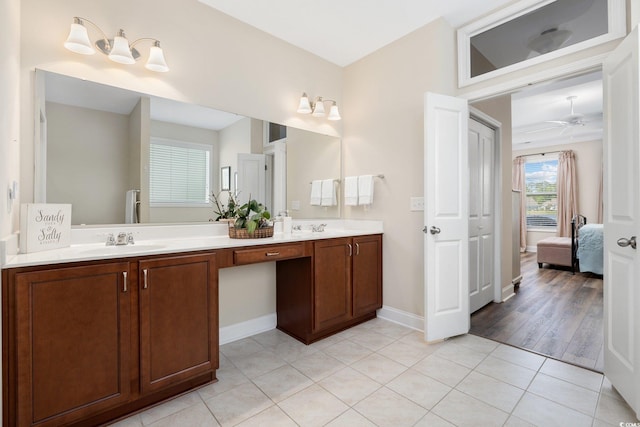 179 Hyacinth Loop, Murrells Inlet, SC 29576 - ensuite bathroom featuring double vanity, a ceiling fan, a sink, tile patterned floors, and ensuite bathroom