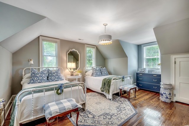 402 E Broad St, Hemingway, SC 29554 - bedroom with multiple windows, vaulted ceiling, and wood finished floors