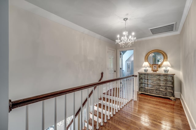 402 E Broad St, Hemingway, SC 29554 - corridor featuring a chandelier, wood finished floors, and an upstairs landing