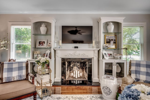 402 E Broad St, Hemingway, SC 29554 - living room with healthy amount of natural light, a fireplace, wood finished floors, and ornamental molding
