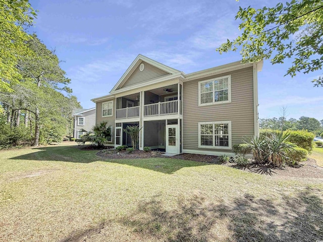 1041 Blue Stem Dr Unit 37A, Pawleys Island, SC 29585 - back of property with ceiling fan, a balcony, and a lawn