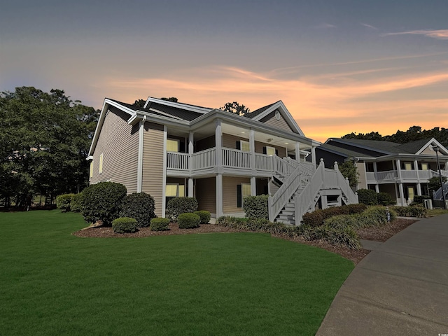 1041 Blue Stem Dr Unit 37A, Pawleys Island, SC 29585 - view of front of home featuring a yard, stairway, and covered porch