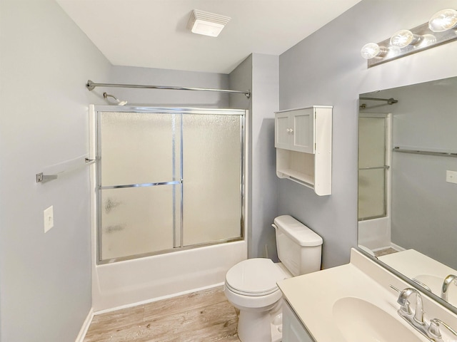1041 Blue Stem Dr Unit 37A, Pawleys Island, SC 29585 - full bathroom with wood finished floors, toilet, vanity, and enclosed tub / shower combo