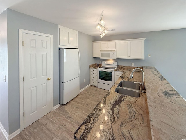 1041 Blue Stem Dr Unit 37A, Pawleys Island, SC 29585 - kitchen with white appliances, a sink, light wood-type flooring, and white cabinetry