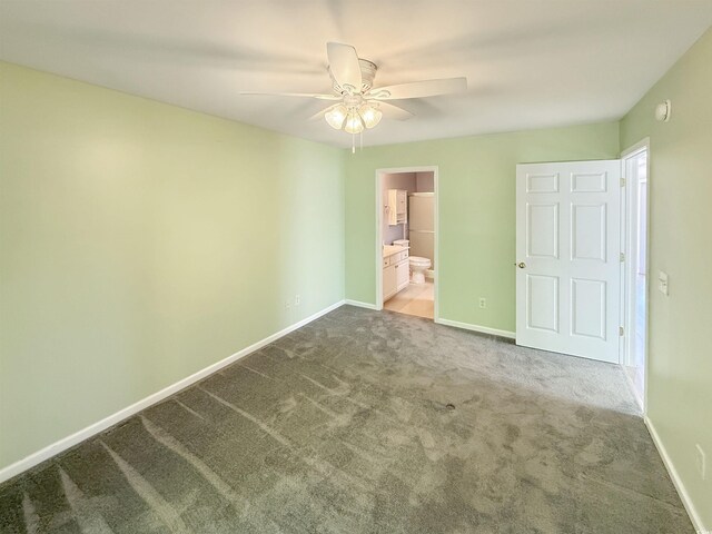 1041 Blue Stem Dr Unit 37A, Pawleys Island, SC 29585 - unfurnished bedroom with baseboards, carpet floors, ensuite bathroom, and a ceiling fan