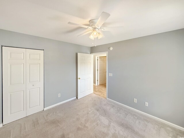 1041 Blue Stem Dr Unit 37A, Pawleys Island, SC 29585 - unfurnished bedroom featuring carpet, baseboards, a closet, and a ceiling fan