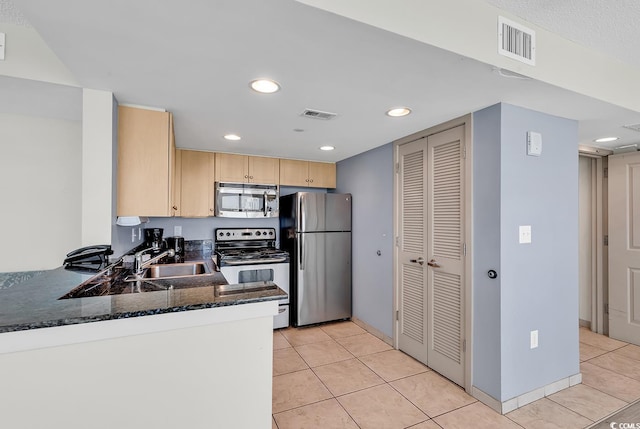 107 S Ocean Blvd Unit 1001, Myrtle Beach, SC 29577 - kitchen featuring a sink, visible vents, light tile patterned floors, light brown cabinets, and appliances with stainless steel finishes