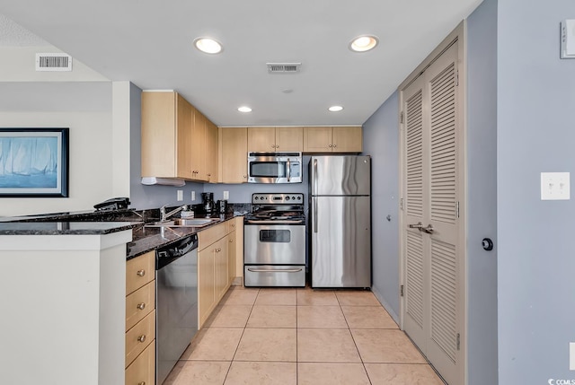 107 S Ocean Blvd Unit 1001, Myrtle Beach, SC 29577 - kitchen featuring stainless steel appliances, light brown cabinets, a sink, and visible vents