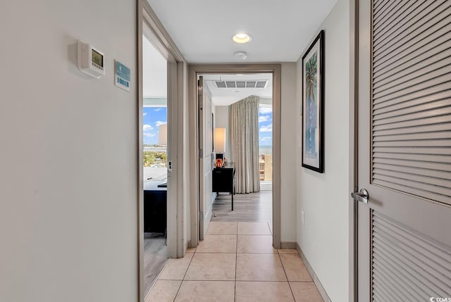 107 S Ocean Blvd Unit 1001, Myrtle Beach, SC 29577 - hall with light tile patterned floors, visible vents, and baseboards