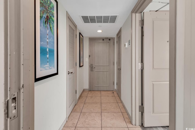 107 S Ocean Blvd Unit 1001, Myrtle Beach, SC 29577 - corridor featuring light tile patterned floors, baseboards, and visible vents