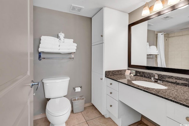 107 S Ocean Blvd Unit 1001, Myrtle Beach, SC 29577 - bathroom featuring vanity, toilet, visible vents, and tile patterned flooring