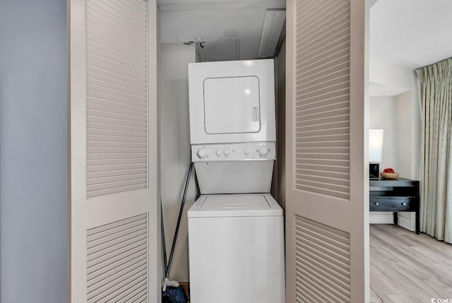 107 S Ocean Blvd Unit 1001, Myrtle Beach, SC 29577 - laundry area featuring laundry area, stacked washer and clothes dryer, attic access, and wood finished floors
