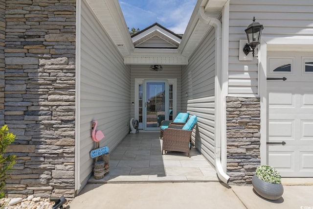 804 Twickenham Loop, Longs, SC 29568 - property entrance featuring stone siding and a patio area