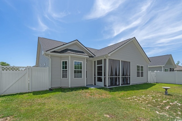 804 Twickenham Loop, Longs, SC 29568 - rear view of house featuring a gate, a fenced backyard, a lawn, a sunroom, and a shingled roof