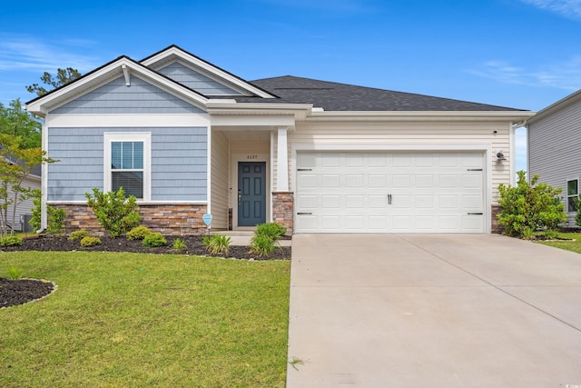 4609 Day Lily Run St, Myrtle Beach, SC 29579 - craftsman inspired home featuring stone siding, concrete driveway, an attached garage, and a front yard