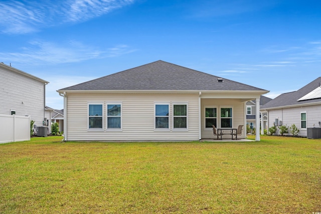 4609 Day Lily Run St, Myrtle Beach, SC 29579 - rear view of house with a lawn, a patio, central AC unit, and a shingled roof