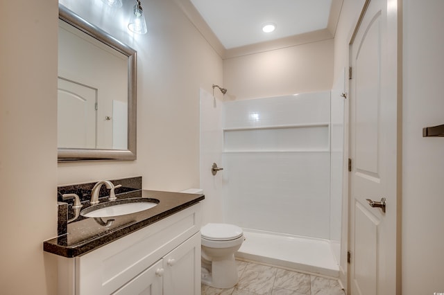 bathroom featuring a tile shower, marble finish floor, vanity, and toilet