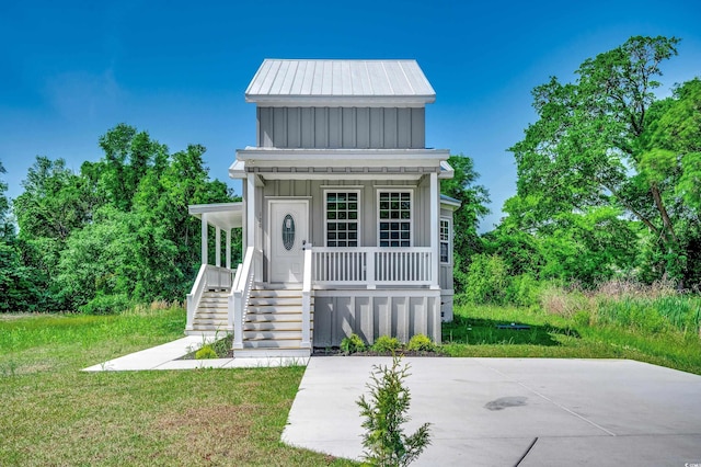 view of outdoor structure with a porch and stairway