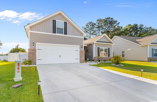 view of front of house featuring an attached garage, concrete driveway, board and batten siding, a front yard, and brick siding