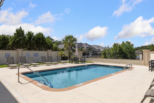 220 Waterfall Cir, Little River, SC 29566 - community pool featuring a patio area and fence