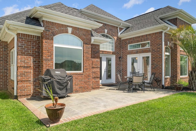 220 Waterfall Cir, Little River, SC 29566 - rear view of house with roof with shingles, a patio area, french doors, and brick siding