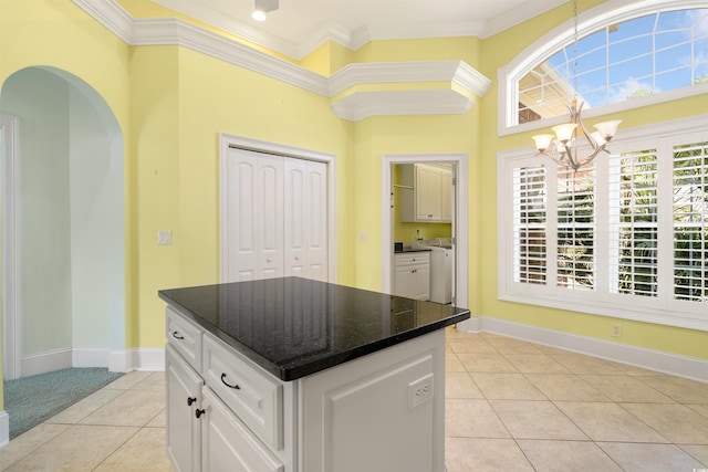 220 Waterfall Cir, Little River, SC 29566 - kitchen with light tile patterned floors, white cabinets, baseboards, a chandelier, and ornamental molding