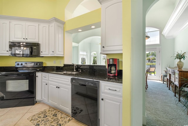 220 Waterfall Cir, Little River, SC 29566 - kitchen featuring a high ceiling, a sink, white cabinetry, arched walkways, and black appliances