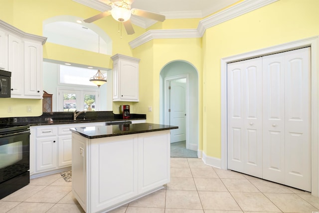220 Waterfall Cir, Little River, SC 29566 - kitchen featuring a center island, a sink, white cabinetry, ceiling fan, and black appliances