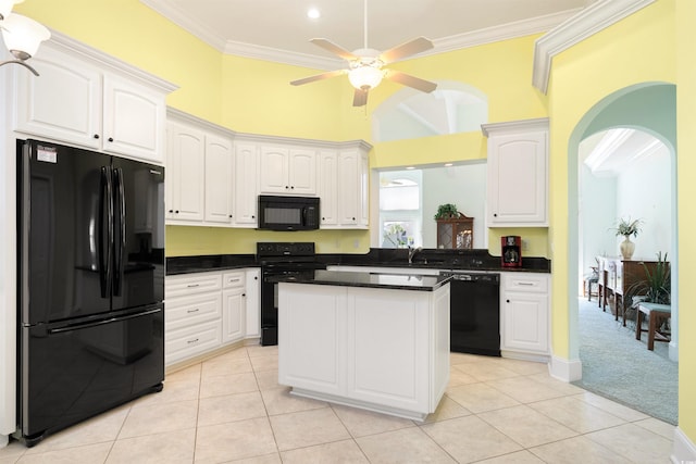 220 Waterfall Cir, Little River, SC 29566 - kitchen with dark countertops, white cabinetry, ceiling fan, black appliances, and ornamental molding