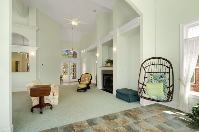 220 Waterfall Cir, Little River, SC 29566 - living area with a ceiling fan, high vaulted ceiling, a fireplace with flush hearth, carpet floors, and arched walkways