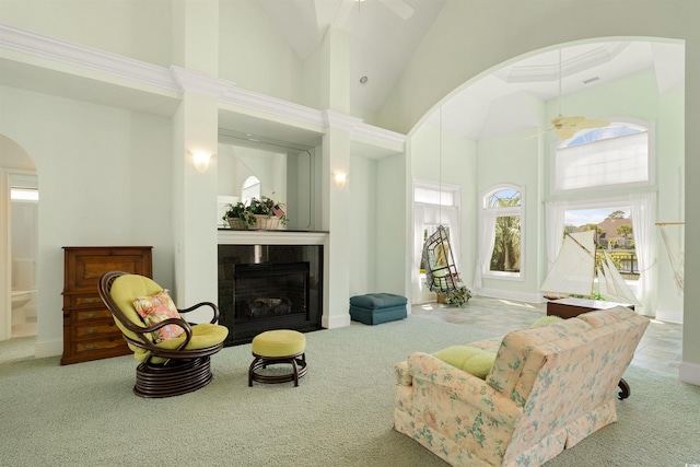 220 Waterfall Cir, Little River, SC 29566 - living room with carpet floors, a ceiling fan, arched walkways, and high vaulted ceiling