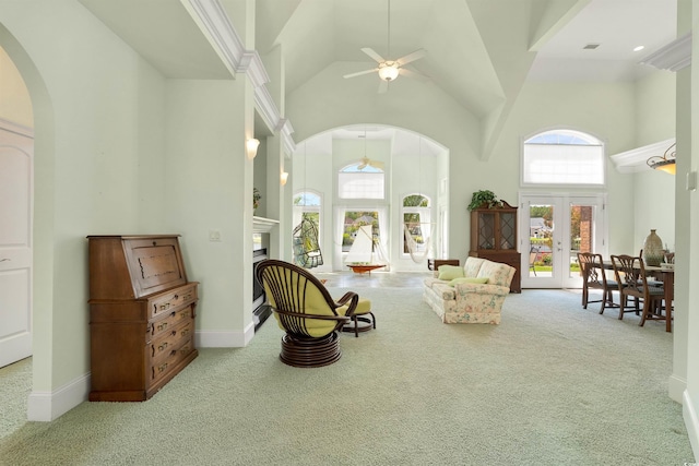 220 Waterfall Cir, Little River, SC 29566 - living area with a towering ceiling, carpet, arched walkways, and a healthy amount of sunlight