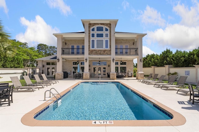 220 Waterfall Cir, Little River, SC 29566 - community pool featuring ceiling fan, a patio area, french doors, and fence