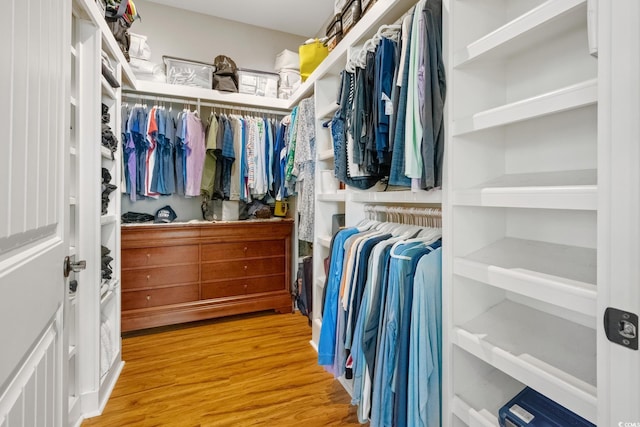 walk in closet featuring wood finished floors