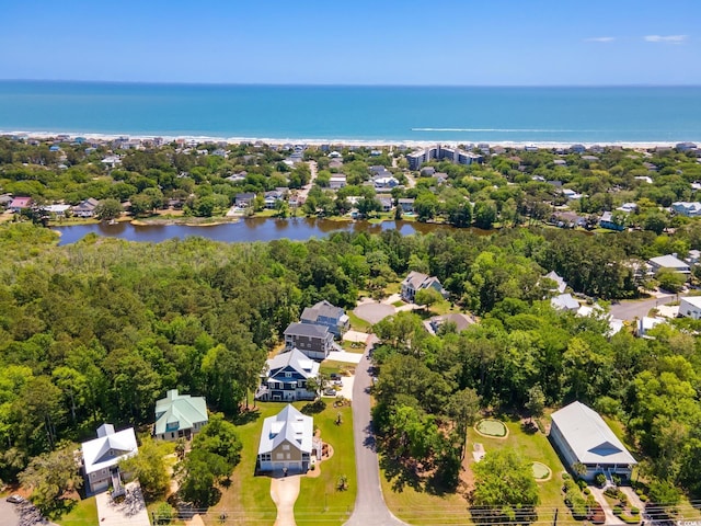 drone / aerial view featuring a water view and a residential view