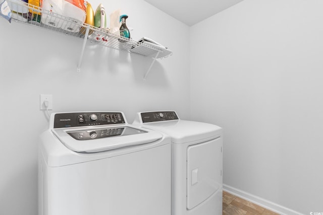 1123 Fairway Ln Unit 1123, Conway, SC 29526 - clothes washing area featuring separate washer and dryer, laundry area, baseboards, and stone finish flooring