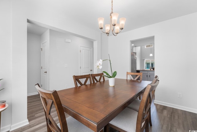 1123 Fairway Ln Unit 1123, Conway, SC 29526 - dining space with a notable chandelier, baseboards, and wood finished floors