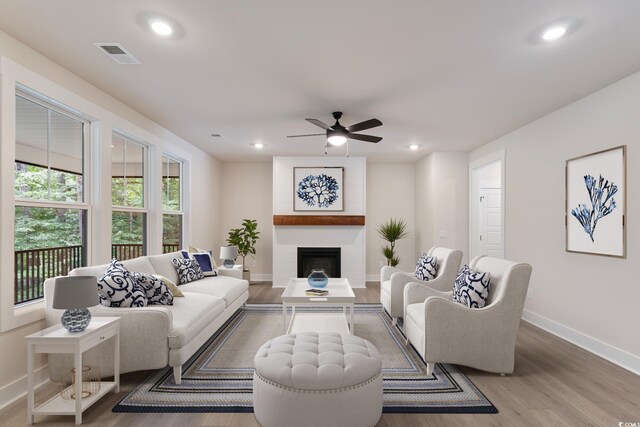 1061 Edenton Dr, Calabash, NC 28467 - living area featuring wood finished floors, visible vents, baseboards, ceiling fan, and recessed lighting