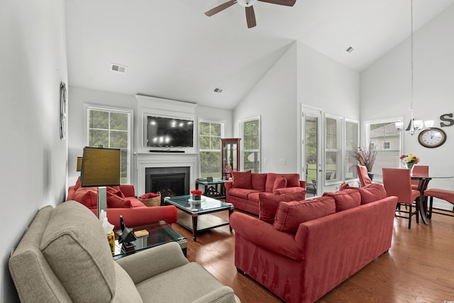 4246 Livorn Loop, Myrtle Beach, SC 29579 - living area with ceiling fan with notable chandelier, high vaulted ceiling, visible vents, and wood finished floors