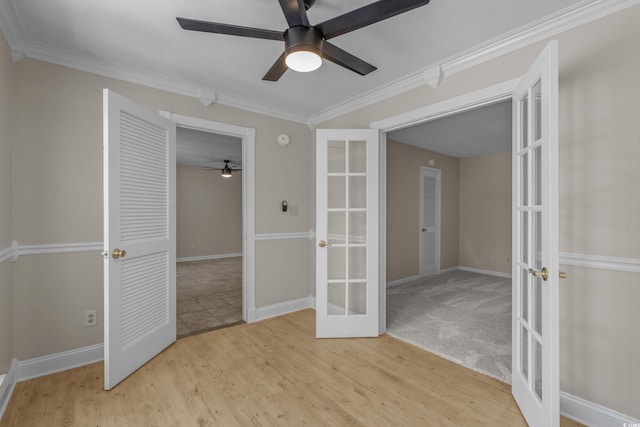 900 Courtyard Dr Unit K7, Myrtle Beach, SC 29577 - unfurnished bedroom featuring wood finished floors, french doors, a ceiling fan, baseboards, and ornamental molding