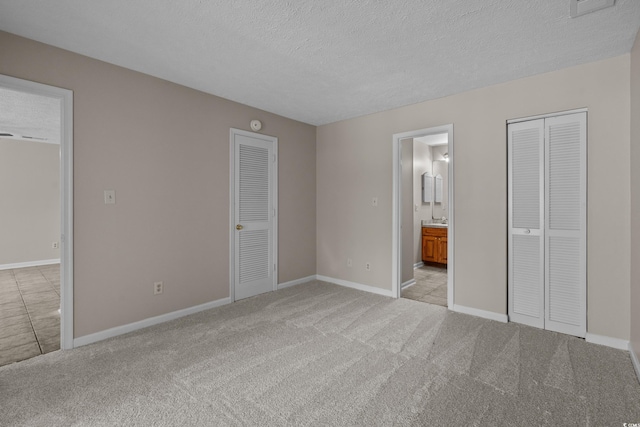 900 Courtyard Dr Unit K7, Myrtle Beach, SC 29577 - unfurnished bedroom featuring a textured ceiling, light carpet, and baseboards