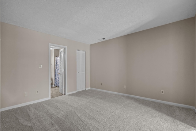 900 Courtyard Dr Unit K7, Myrtle Beach, SC 29577 - spare room featuring baseboards, light carpet, visible vents, and a textured ceiling