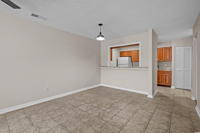 900 Courtyard Dr Unit K7, Myrtle Beach, SC 29577 - interior space with a textured ceiling, baseboards, light tile patterned floors, and visible vents